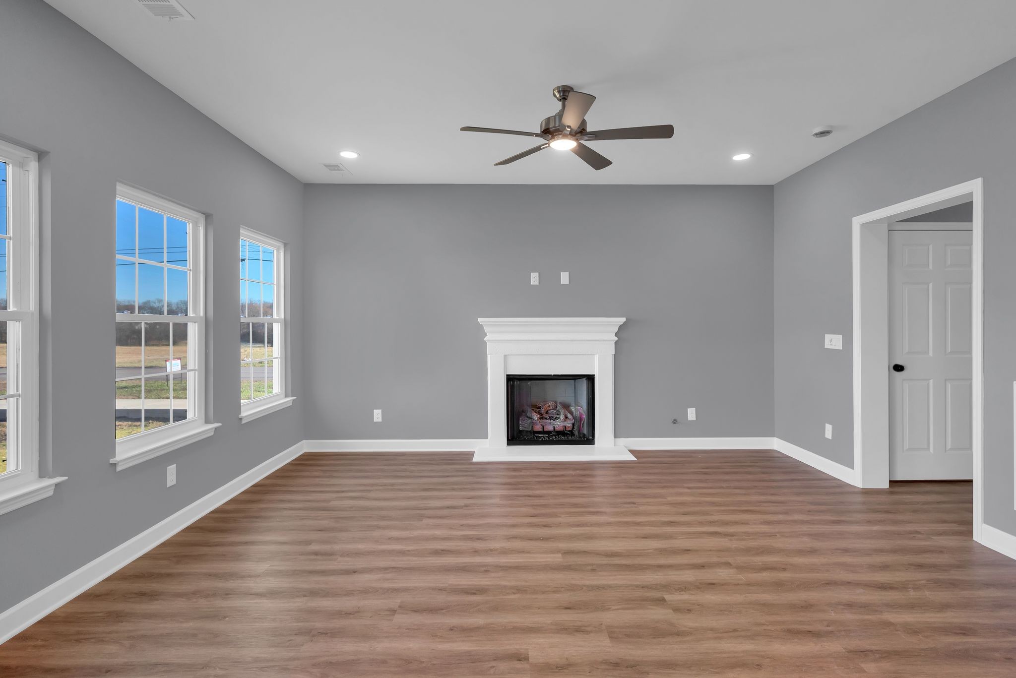 889 Blessing Way Gallatin, TN 37066 - Photo 11 of 37 a view of empty room with wooden floor and fan