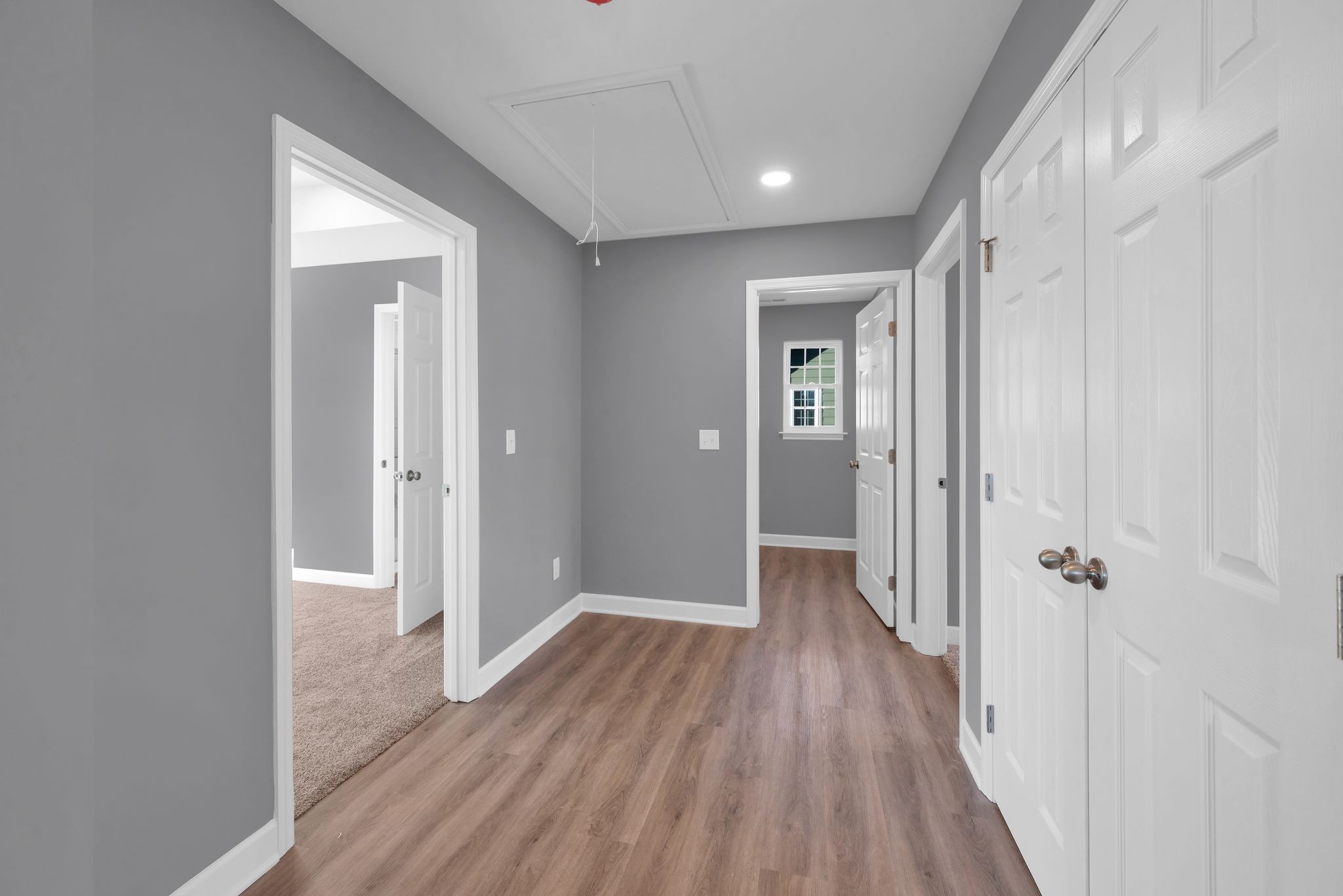 889 Blessing Way Gallatin, TN 37066 - Photo 34 of 37 a view of a hallway with wooden floor and closet area
