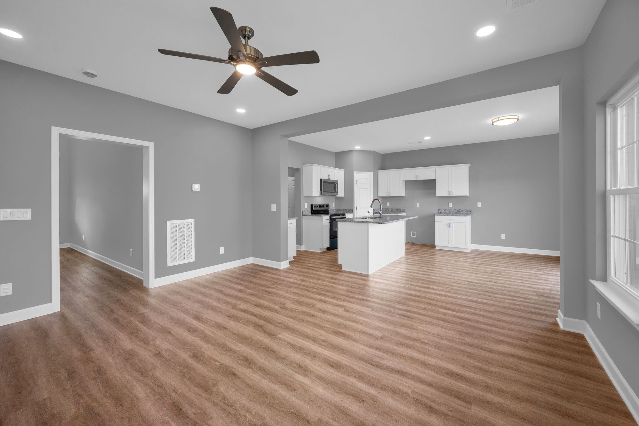 889 Blessing Way Gallatin, TN 37066 - Photo 8 of 37 a view of kitchen with wooden floor and a window