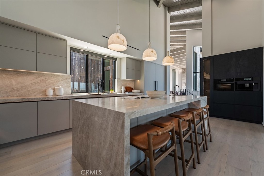 3121 Old Topanga Canyon Road Calabasas, CA 91302 - Photo 16 of 75 a kitchen with stainless steel appliances granite countertop a sink and a refrigerator