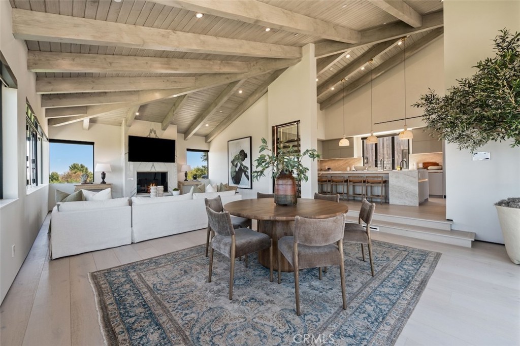 3121 Old Topanga Canyon Road Calabasas, CA 91302 - Photo 21 of 75 a dining room with furniture a rug and wooden floor