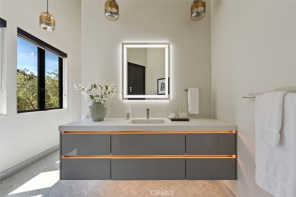3121 Old Topanga Canyon Road Calabasas, CA 91302 - Photo 32 of 75 a bathroom with a sink and a mirror