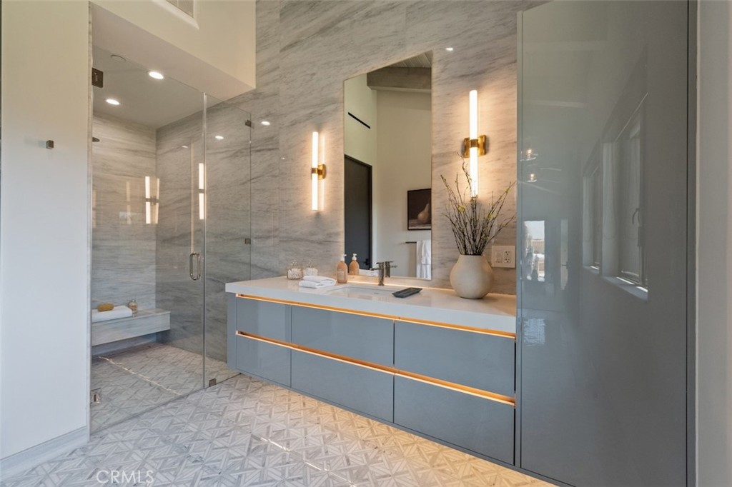 3121 Old Topanga Canyon Road Calabasas, CA 91302 - Photo 34 of 75 a bathroom with a double vanity sink mirror and shower