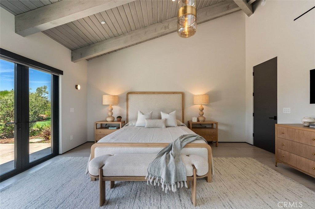 3121 Old Topanga Canyon Road Calabasas, CA 91302 - Photo 36 of 75 a bedroom with a bed and wooden floor