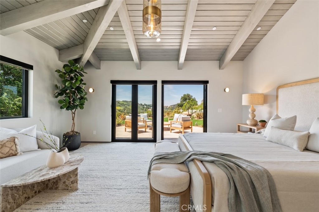 3121 Old Topanga Canyon Road Calabasas, CA 91302 - Photo 38 of 75 a bedroom with furniture and a large window