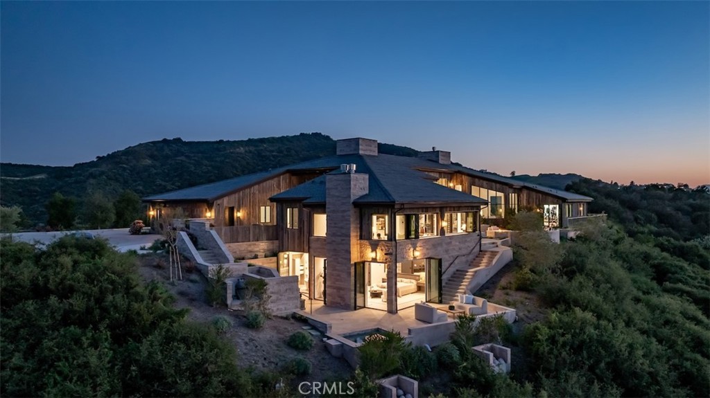 3121 Old Topanga Canyon Road Calabasas, CA 91302 - Photo 55 of 75 a front view of a house with yard and furniture