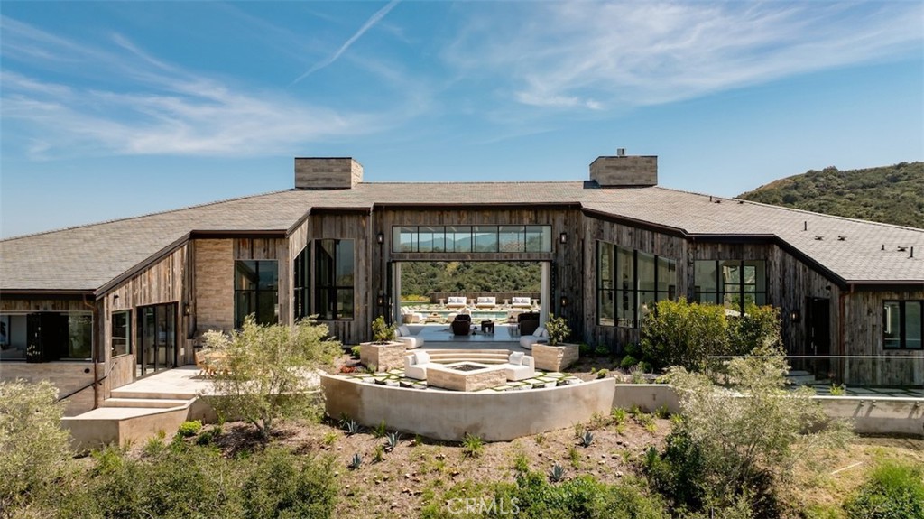 3121 Old Topanga Canyon Road Calabasas, CA 91302 - Photo 6 of 75 a view of a house with sitting area and garden