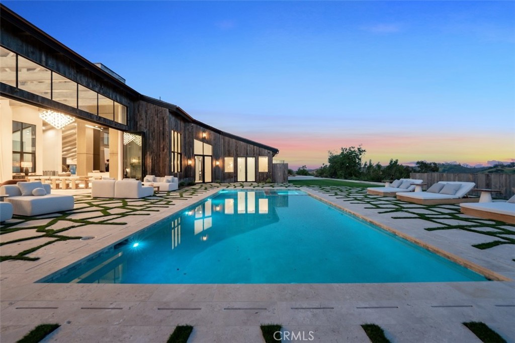 3121 Old Topanga Canyon Road Calabasas, CA 91302 - Photo 75 of 75 a view of a swimming pool with lounge chairs