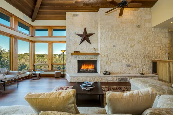 a living room with furniture and a fireplace
