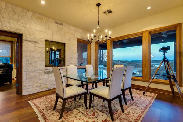 a view of a dining room with furniture wooden floor and chandelier