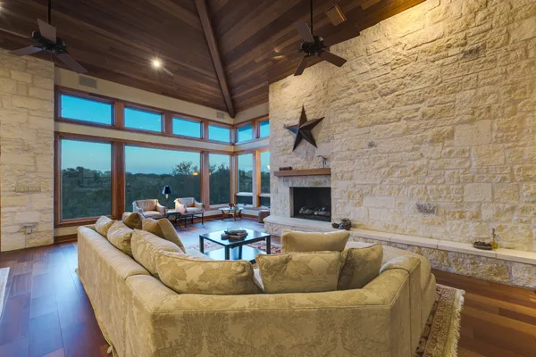 a living room with furniture and a fireplace