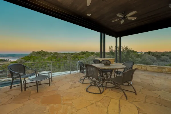 a view of a swimming pool with an outdoor seating