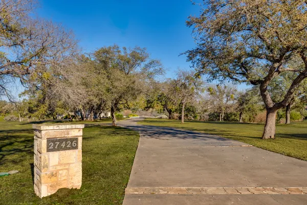 a view of a park with large trees