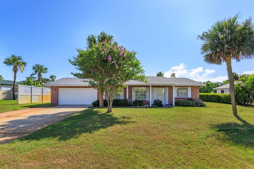 4319 South Peninsula Drive Ponce Inlet, FL 32127 - Photo 1 of 25 a view of a house with a yard and potted plants