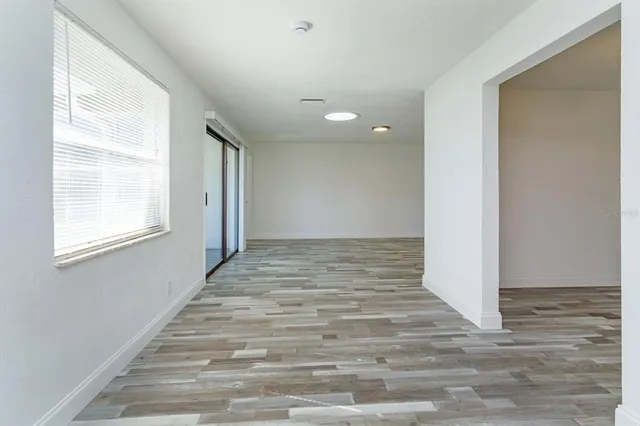 a view of an empty room and window