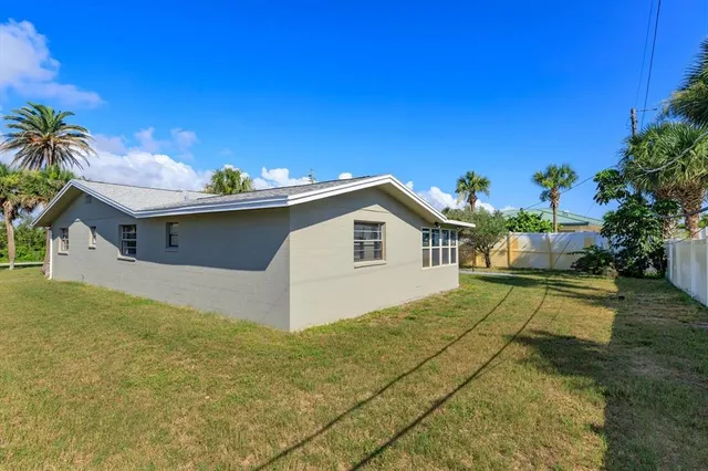 a view of a house with a yard and garage