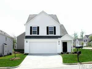 149 Chalcedony Raleigh, NC 27603 - Photo 1 of 1 a front view of a house with a yard