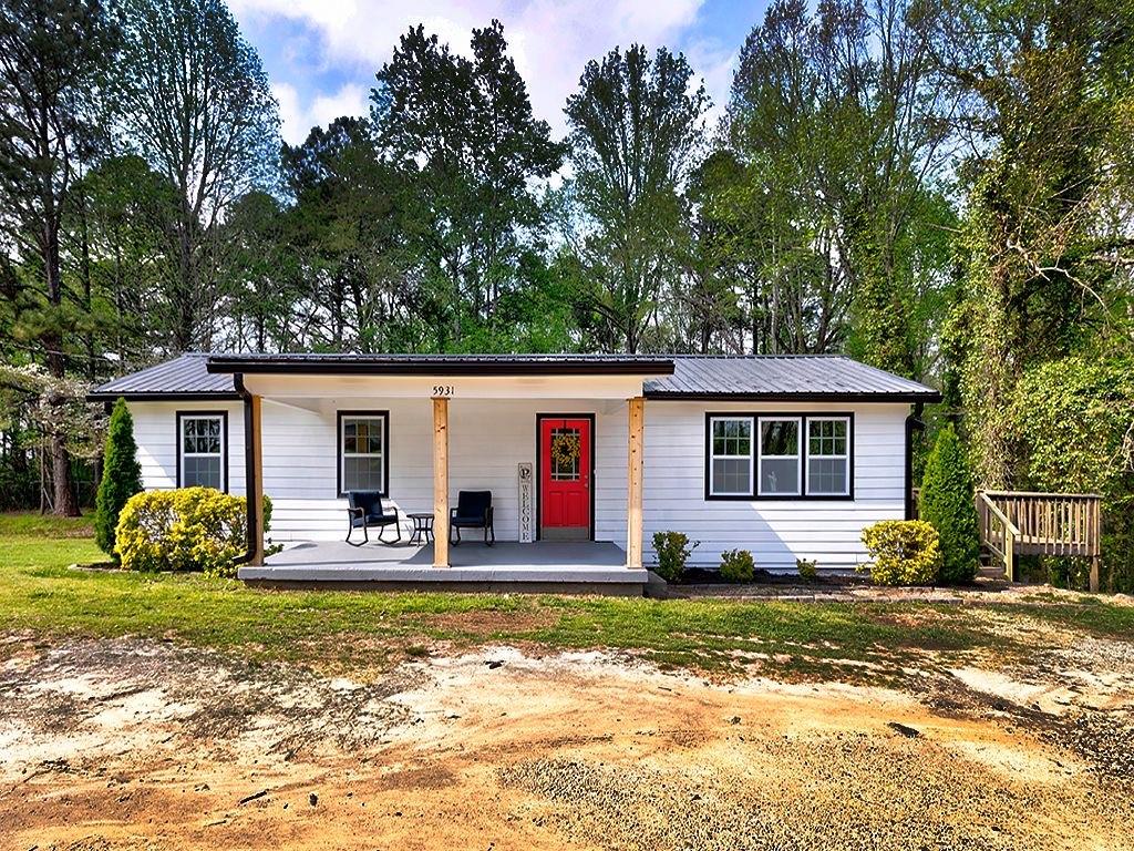 5931 Ridge Road Hiram, GA 30141 - Photo 1 of 1 a view of a house with backyard and trees