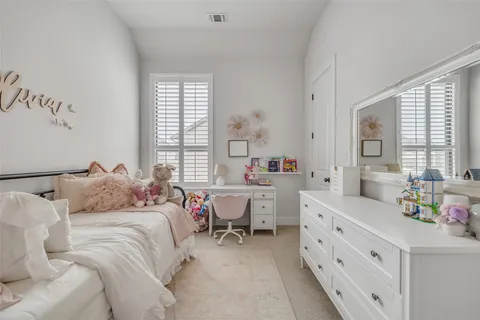 a bed room with a bed and a window