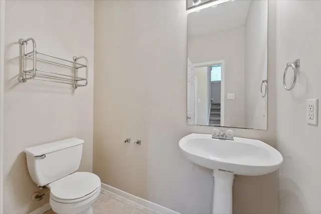 a view of wooden floor and windows in a room
