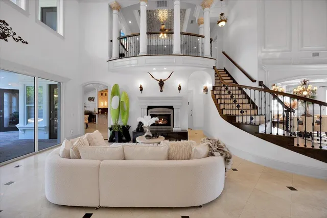 a view of a dining room with furniture and chandelier