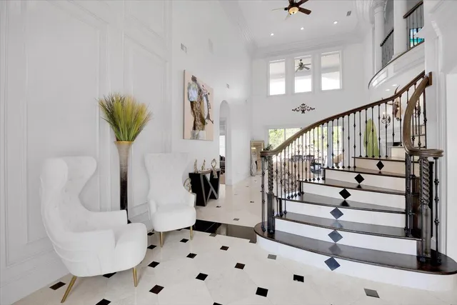 a view of a dining room with furniture and a chandelier