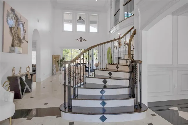 a living room with furniture flowerpot and a potted plant