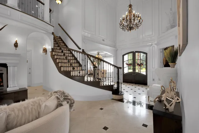 a kitchen with stainless steel appliances granite countertop a sink and a stove