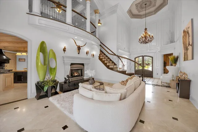 a kitchen with stainless steel appliances a sink a stove and a wooden floors