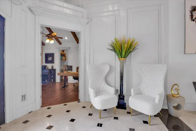 a workspace with furniture window and wooden floor