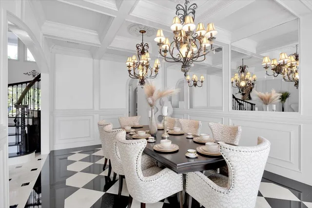 a kitchen that has a sink a counter top space and stainless steel appliances