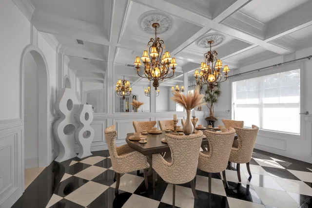 a room with pool table and window