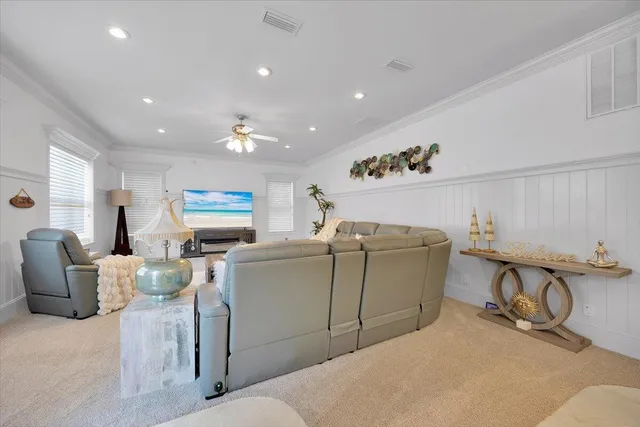a view of a workspace with furniture and wooden floor