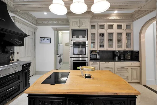a bathroom with a tub toilet sink and mirror