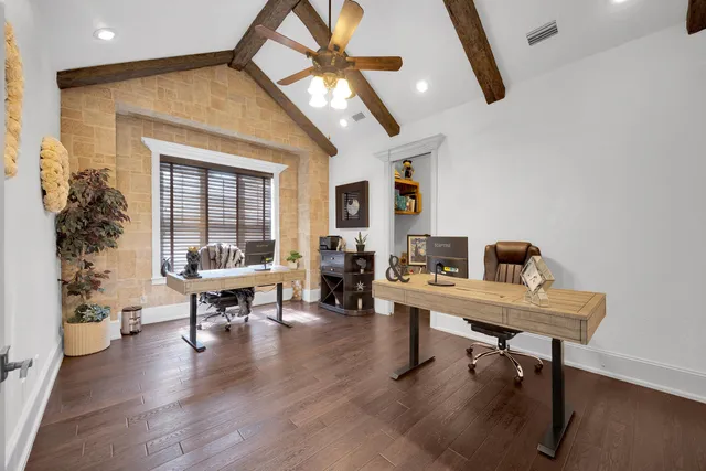 a view of a yard with plants and a fence