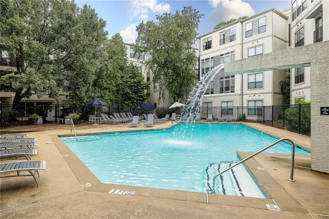 a view of a swimming pool with a patio