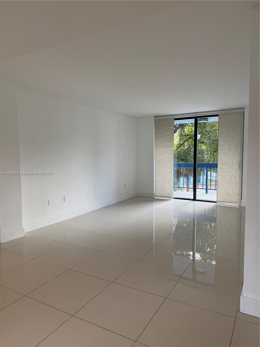 9460 Fontainebleau Boulevard, Unit 331 Miami, FL 33172 - Photo 4 of 17 an empty room with windows