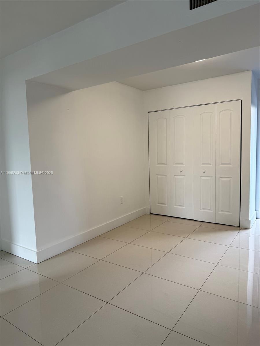 9460 Fontainebleau Boulevard, Unit 331 Miami, FL 33172 - Photo 5 of 17 an empty room with a empty space