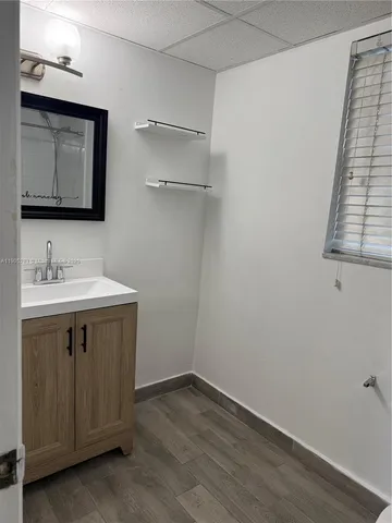 a kitchen with stainless steel appliances a refrigerator sink and cabinets