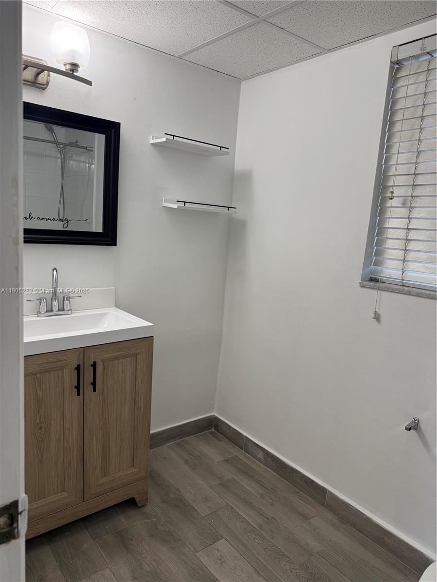 9460 Fontainebleau Boulevard, Unit 331 Miami, FL 33172 - Photo 8 of 17 a bathroom with a sink vanity and a mirror
