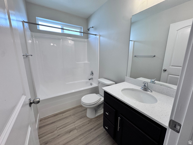 12339 Remy Road, Unit 422 Herriman, UT 84096 - Photo 10 of 36 Full bathroom with vanity, shower / tub combination, and light wood-type flooring