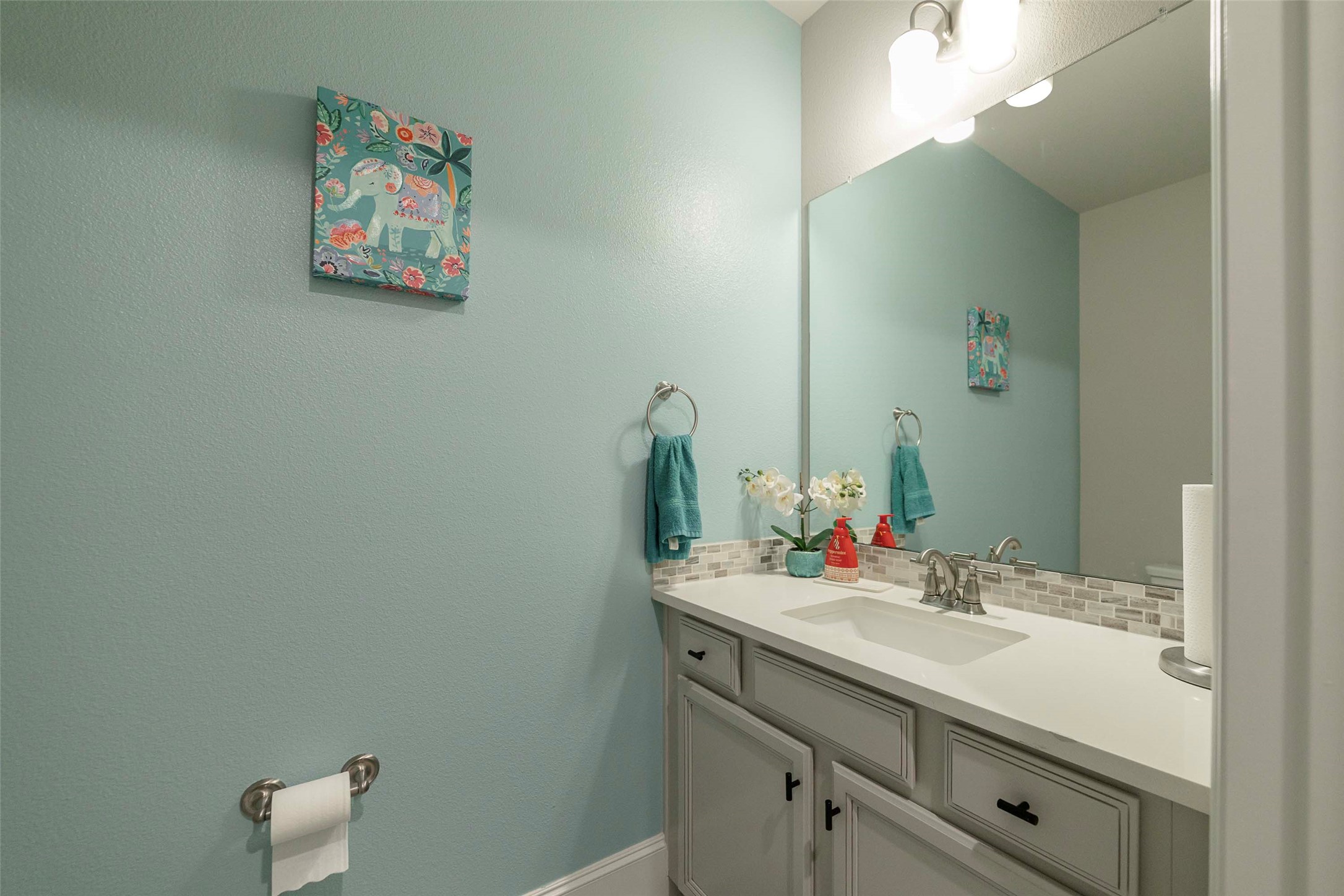 17821 Limestone Spring Lane Austin, TX 78738 - Photo 25 of 40 a bathroom with a sink vanity and mirror