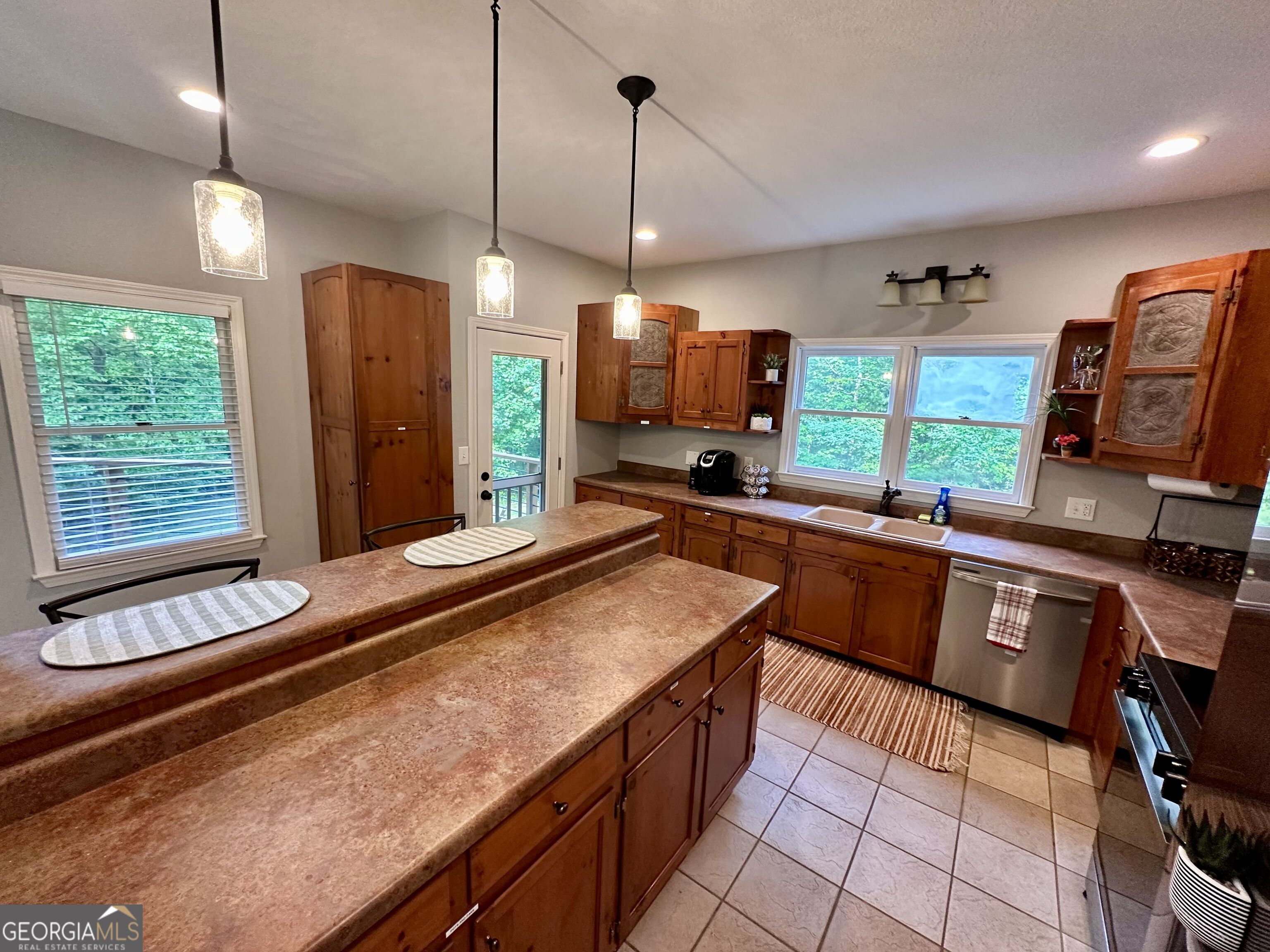 2769 Bean Creek Road Sautee Nacoochee, GA 30571 - Photo 13 of 33 a kitchen with stainless steel appliances granite countertop a sink and a microwave