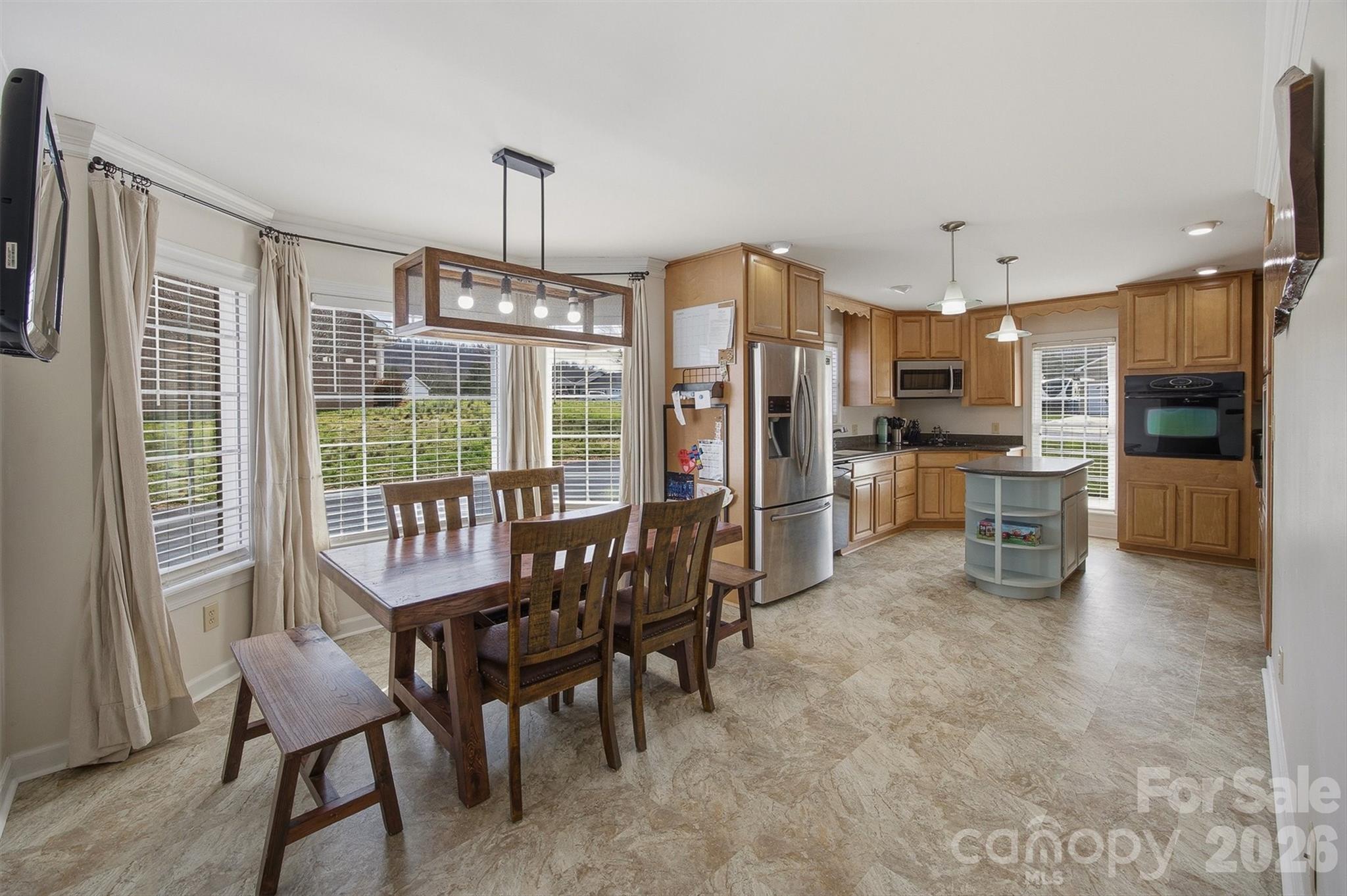2553 Genes Loop Morganton, NC 28655 - Photo 12 of 32 a view of a dining room with furniture window and outside view