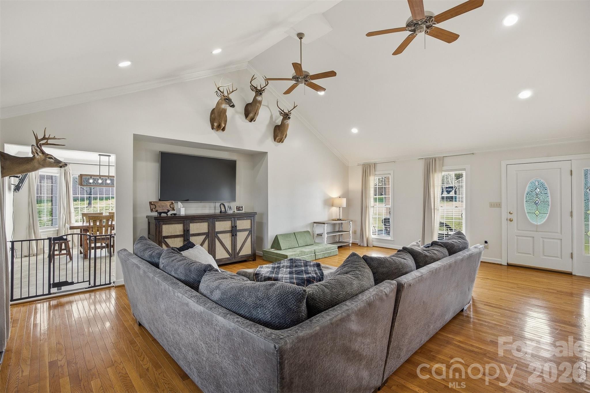 2553 Genes Loop Morganton, NC 28655 - Photo 16 of 32 a living room with furniture and a flat screen tv