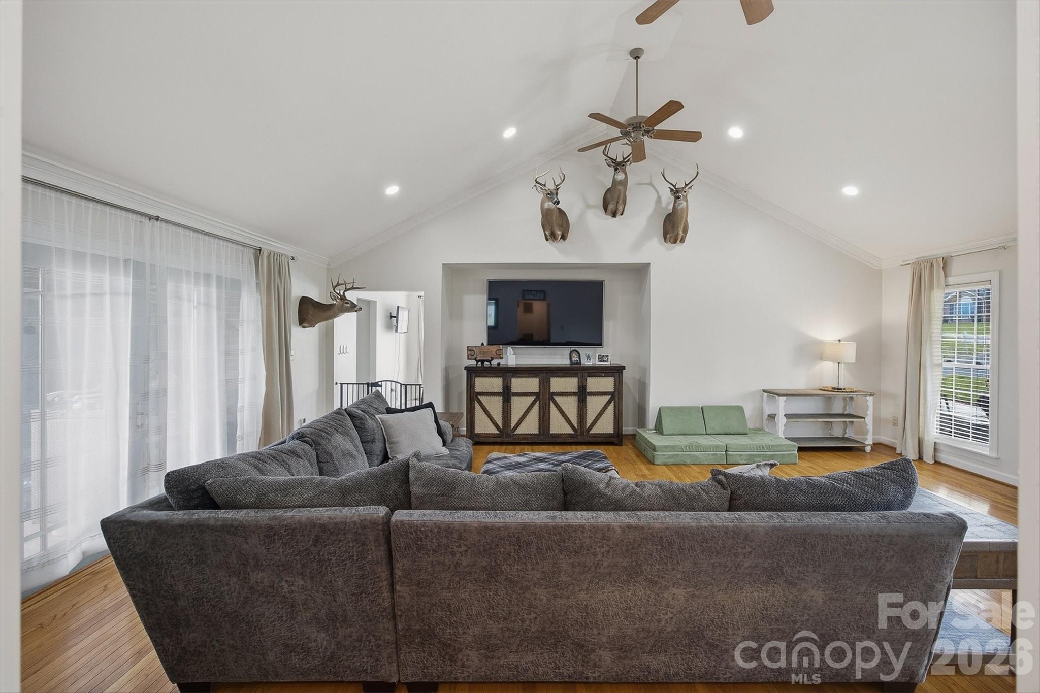 2553 Genes Loop Morganton, NC 28655 - Photo 17 of 32 a living room with furniture and a chandelier