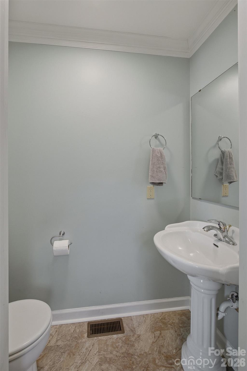 2553 Genes Loop Morganton, NC 28655 - Photo 19 of 32 a bathroom with a sink a toilet and a mirror