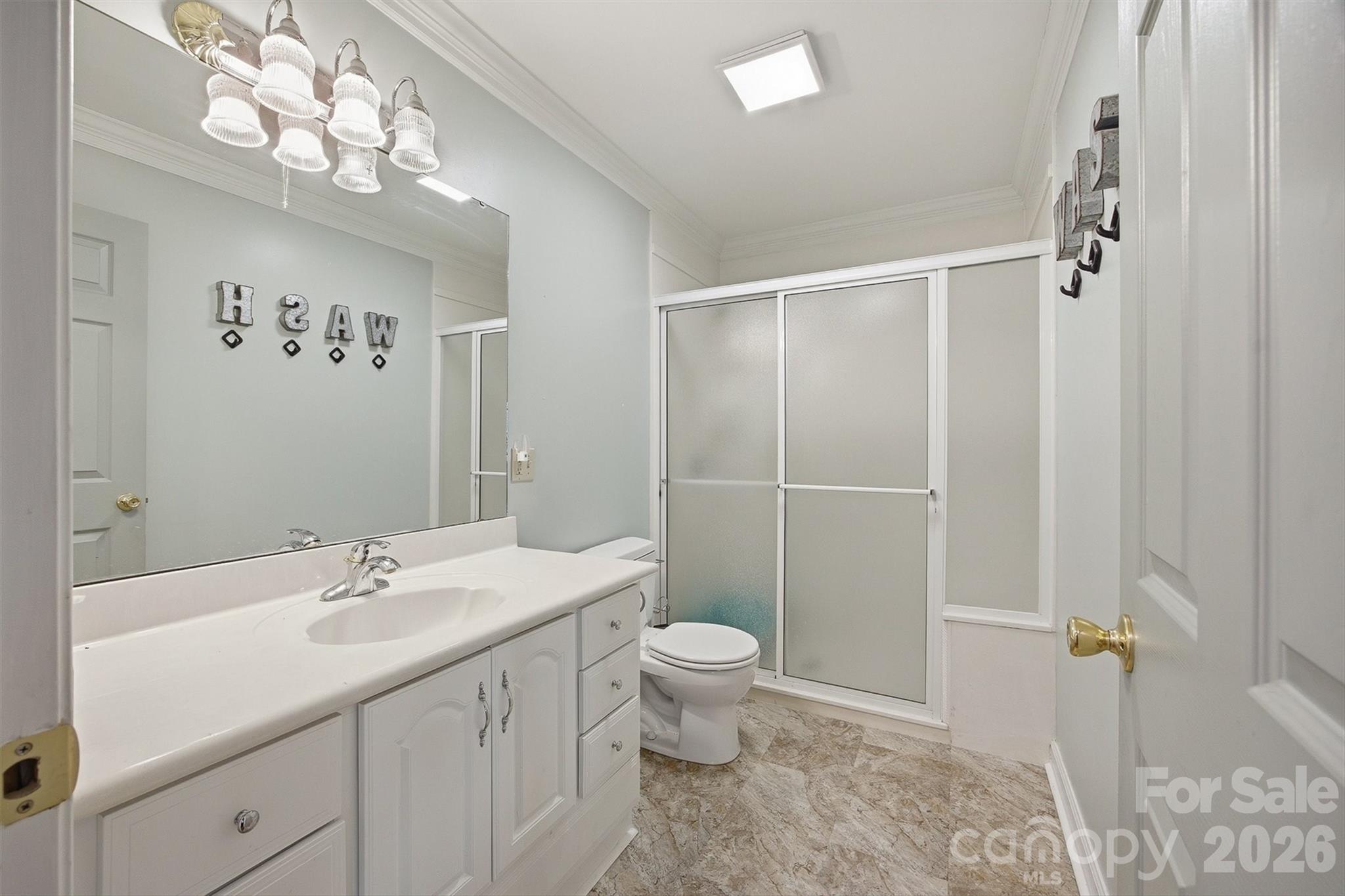 2553 Genes Loop Morganton, NC 28655 - Photo 21 of 32 a bathroom with a sink a toilet and shower