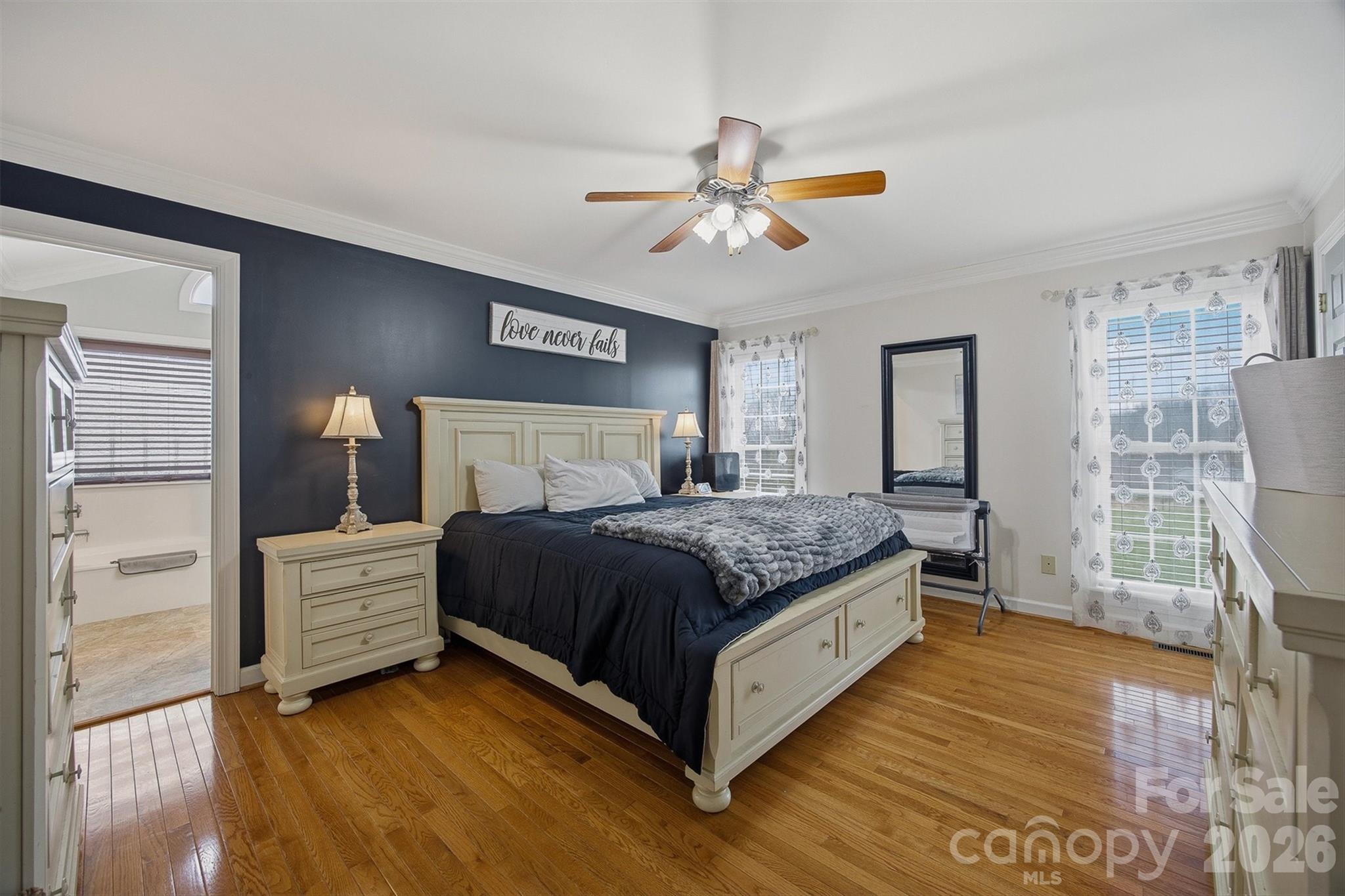 2553 Genes Loop Morganton, NC 28655 - Photo 22 of 32 a bedroom with a bed and a window