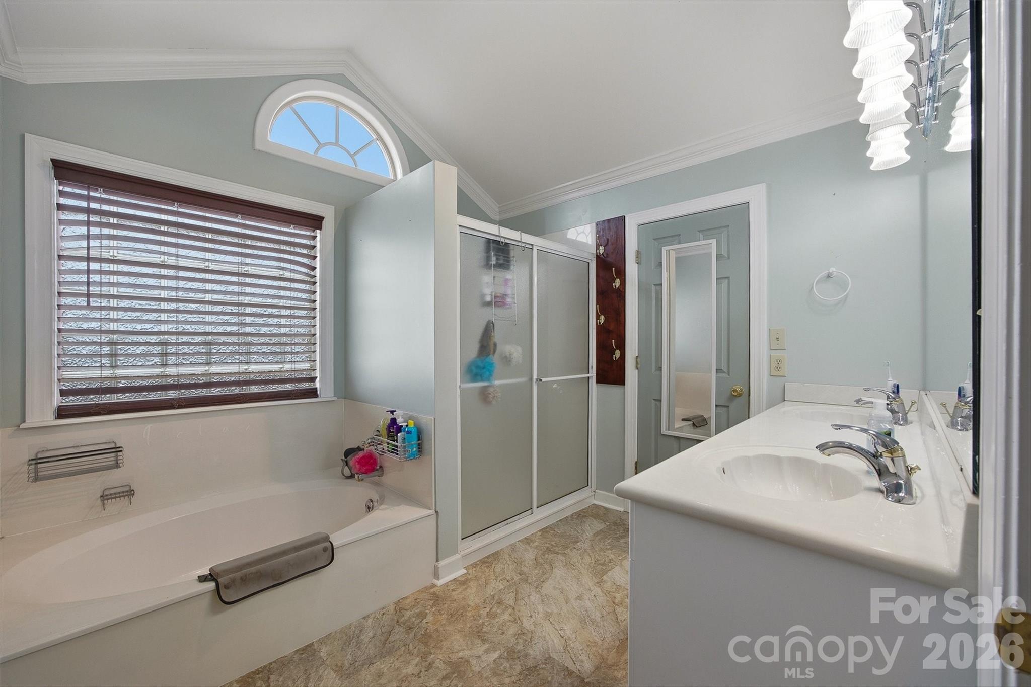 2553 Genes Loop Morganton, NC 28655 - Photo 24 of 32 a bathroom with a tub sink and mirror